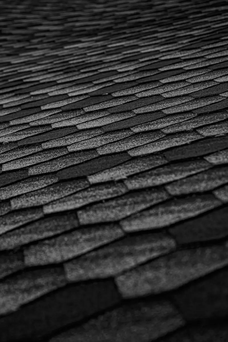 Courses of dark asphalt shingles