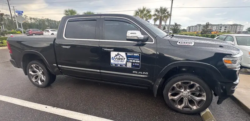 U First Roofing pickup truck with the company logo magnet on the door