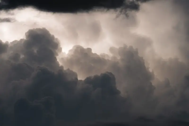 Towering storm clouds with a dark anvil edge